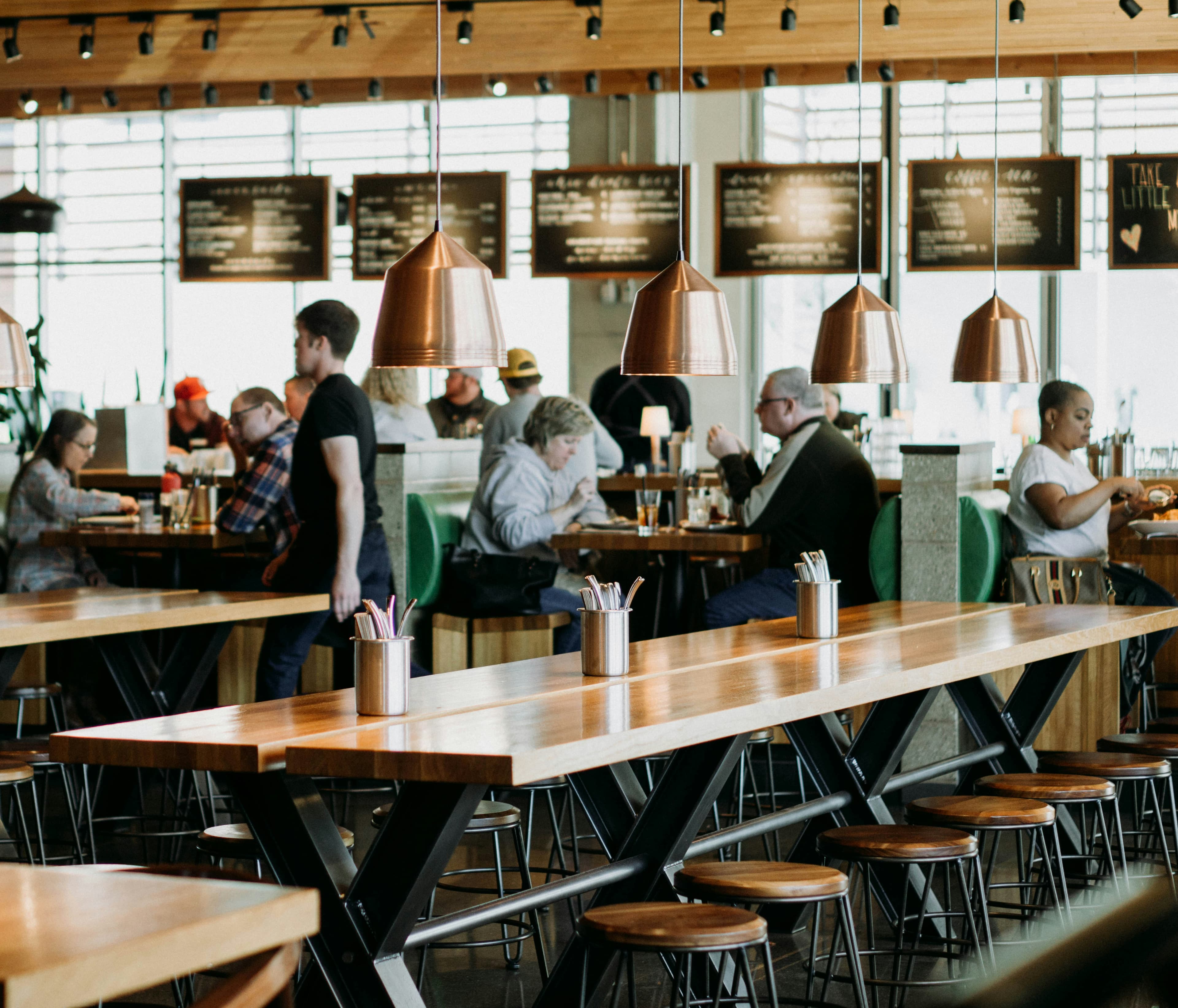 Restaurant interior with self-service kiosk
